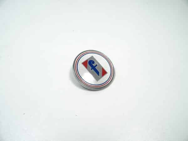 emblem "Pininfarina" round Fiat 124 Spider