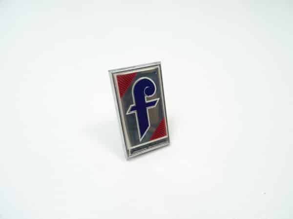 emblem "Pininfarina" front Fiat 124 Spider